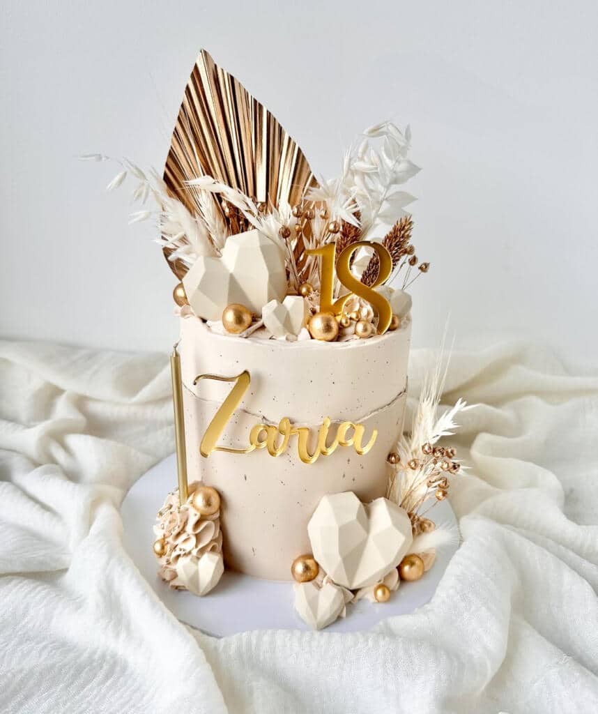 Elegant cake with gold accents and decorations